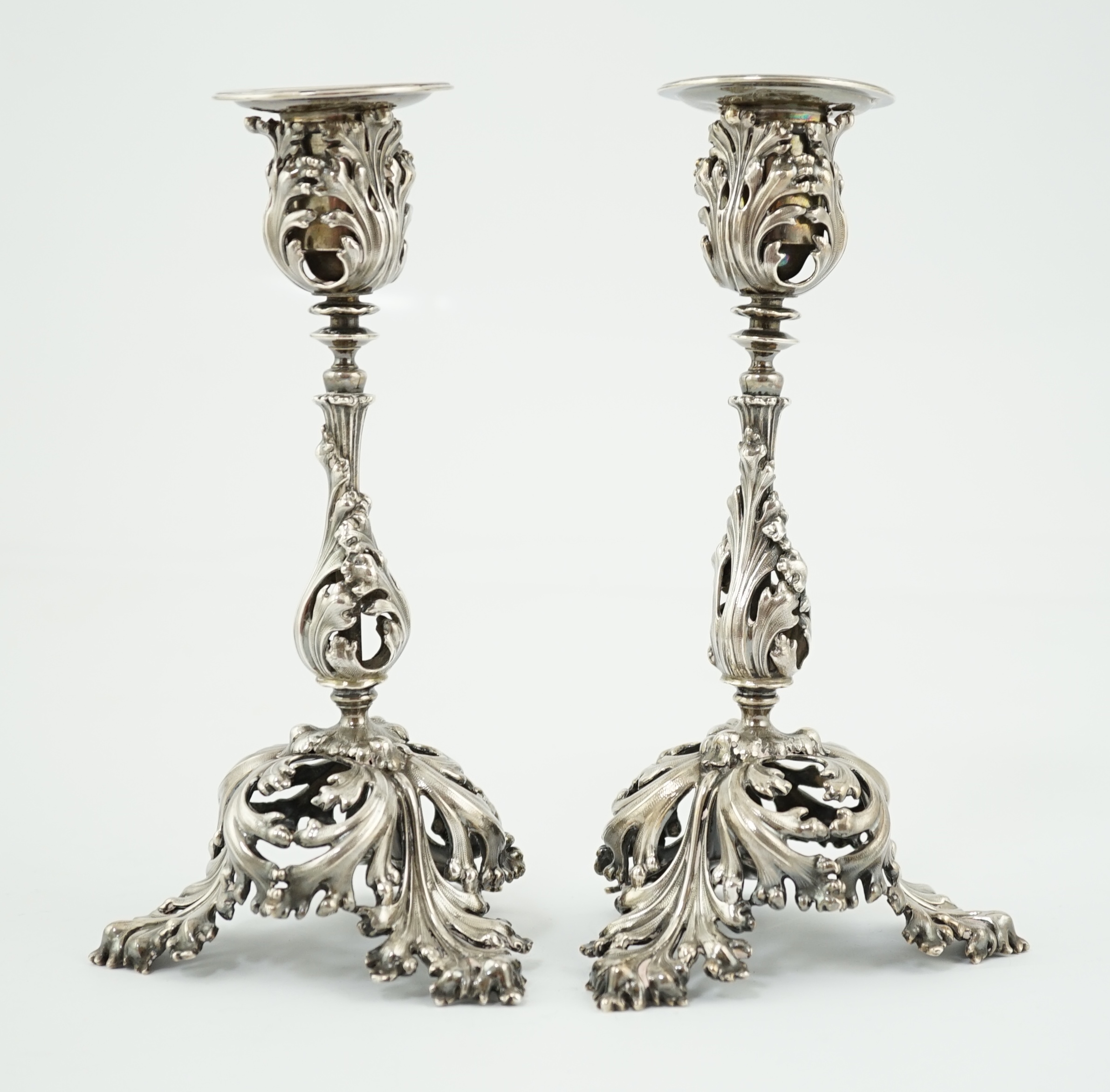 A pair of French pierced 950 standard silver candlesticks